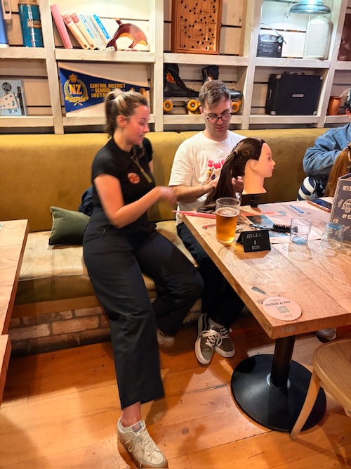 Dads holding craft beers chatting